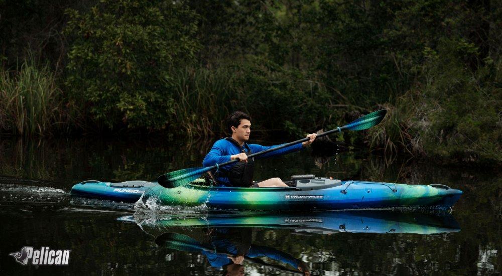 person in a kayak paddling in the water